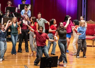 Performers dancing on stage 